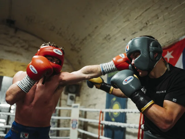 Boxers sparring in the ring during training camp