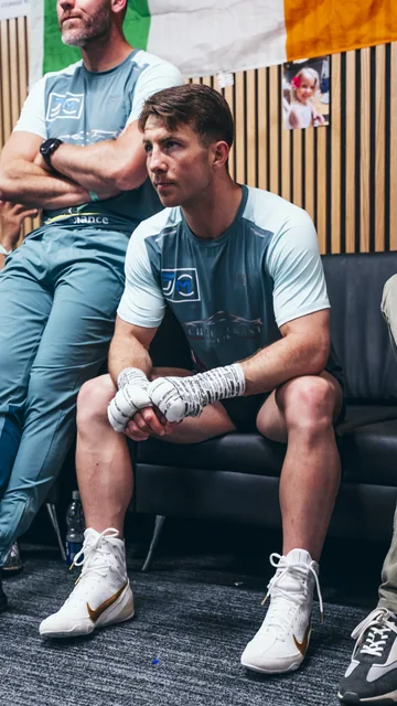 Pierce O’Leary seated backstage with his hands wrapped