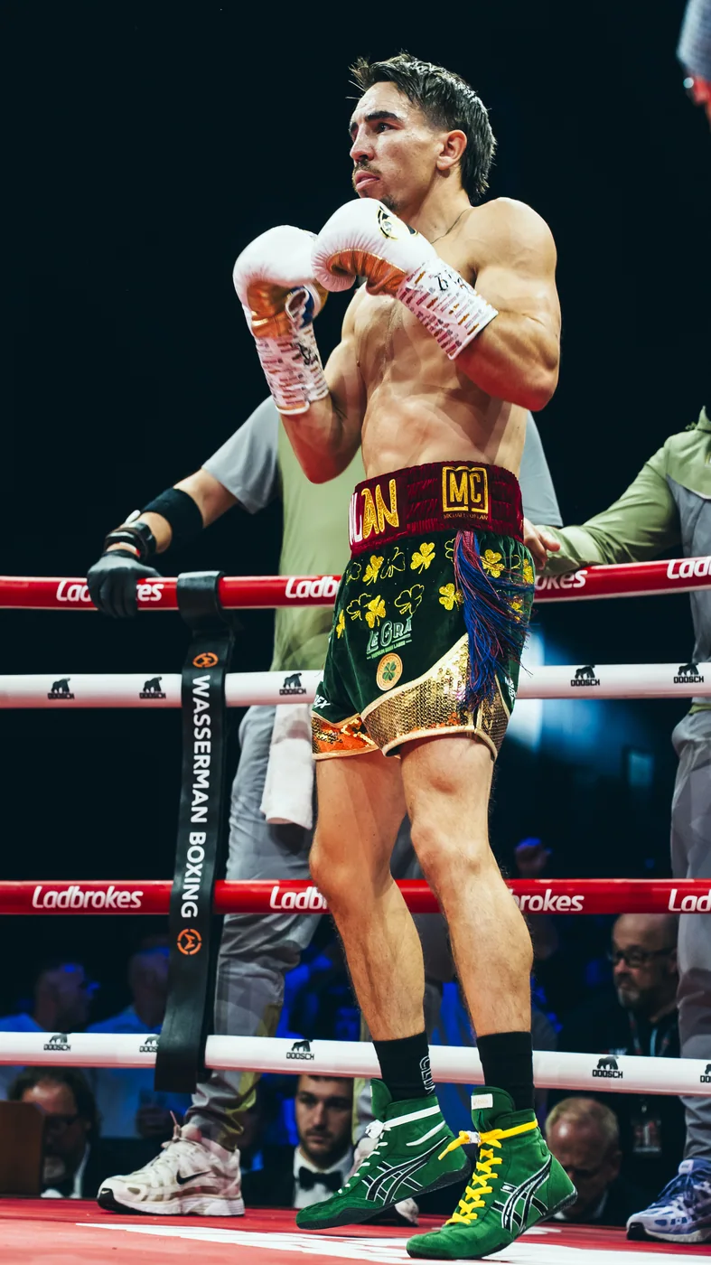 A boxer in his stance inside the ring