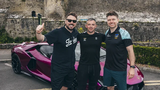 A group campaign photograph beside a bright Lamborghini