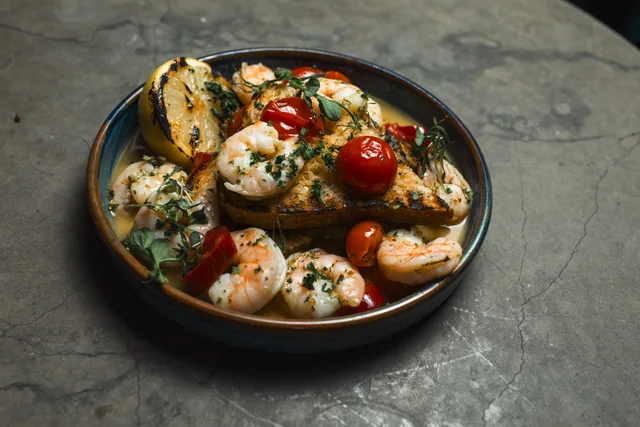A plated dish photographed from above on a stone table