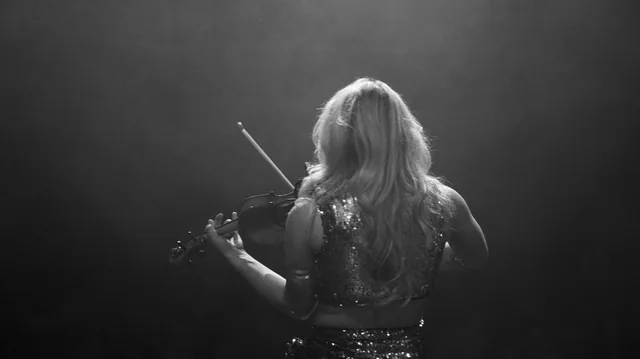 A black and white photograph of Zara Martin performing
