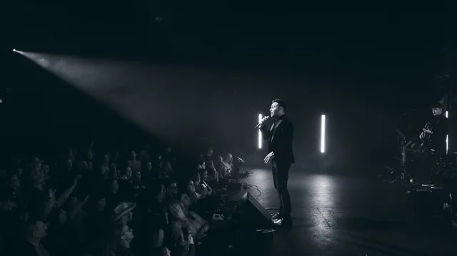 Nathan Carter performing at the TLT in a black and white stage photograph
