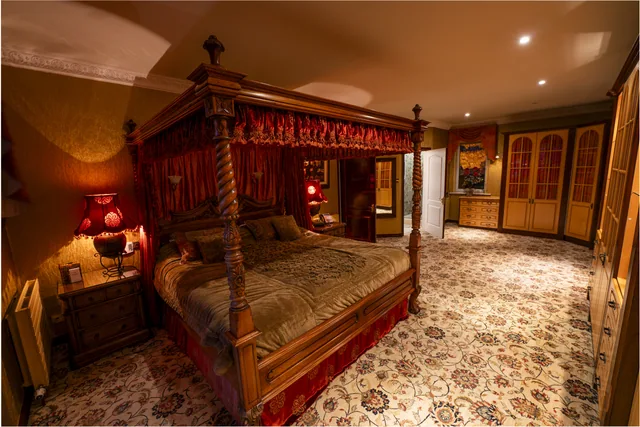 A richly detailed bedroom with a four-poster bed