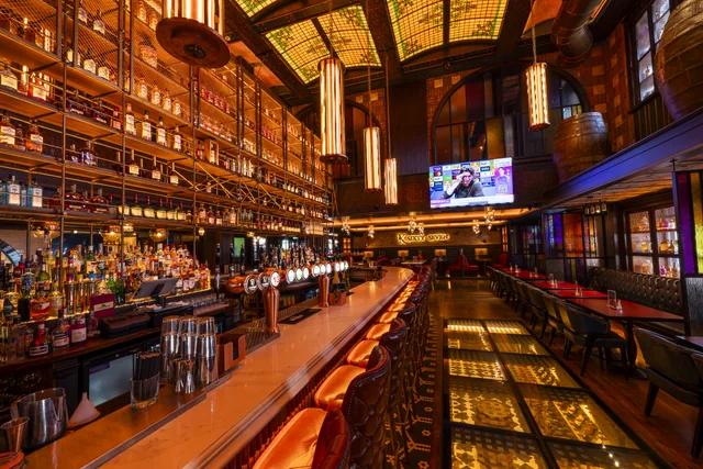 A richly detailed bar interior with warm lighting